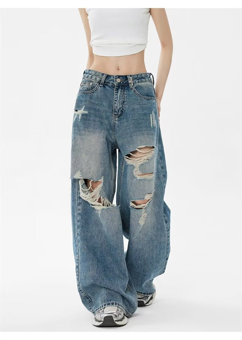 Pantalon en jean bleu taille haute, vue arrière, déchirures aux genoux, ourlet