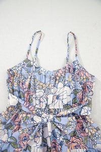 Haut de robe fleurie bleu ciel, encolure arrondie, bretelles spaghetti et volants
