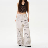 Jean femme crème loose avec lettrage graffiti vintage, jambes larges
