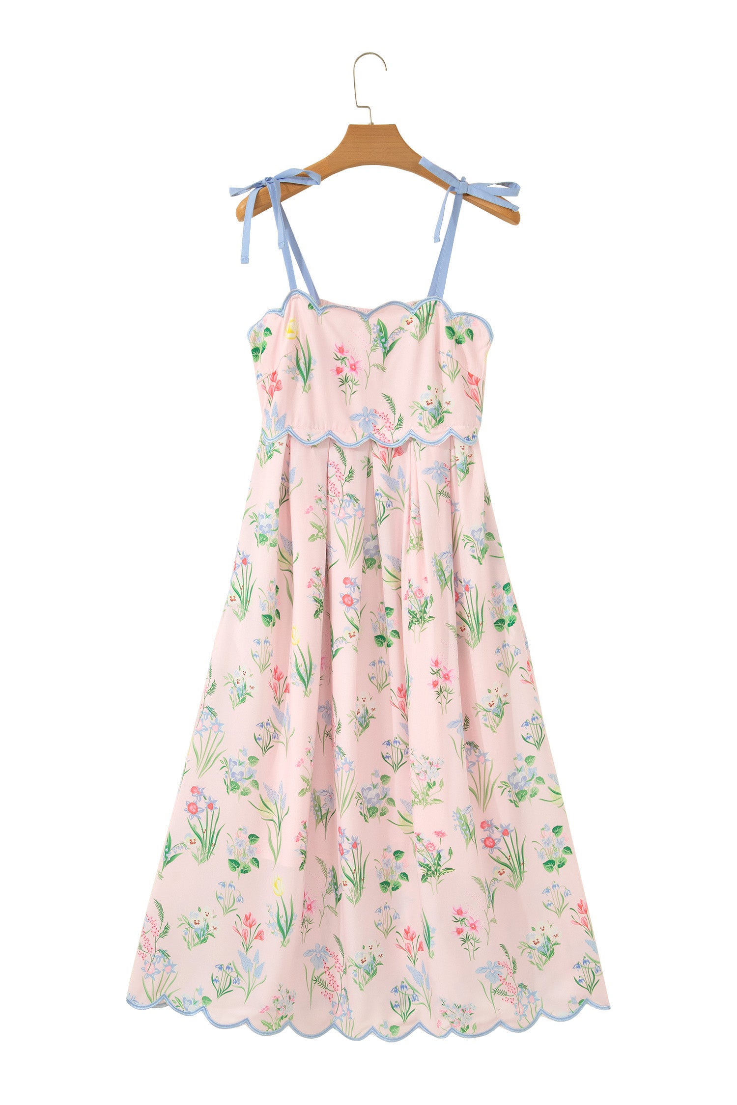 Robe midi rose à bretelles nouées, imprimé floral multicolore, volant bleu festonné.