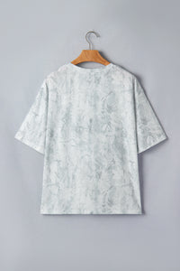 T-shirt gris clair à manches courtes, dos avec motif discret