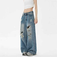 Pantalon en jean bleu taille haute, jambe large, déchirures sur l’avant et la poche