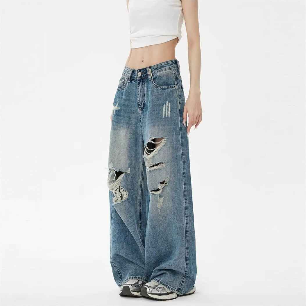 Pantalon en jean bleu taille haute, jambe large, déchirures sur l’avant et la poche