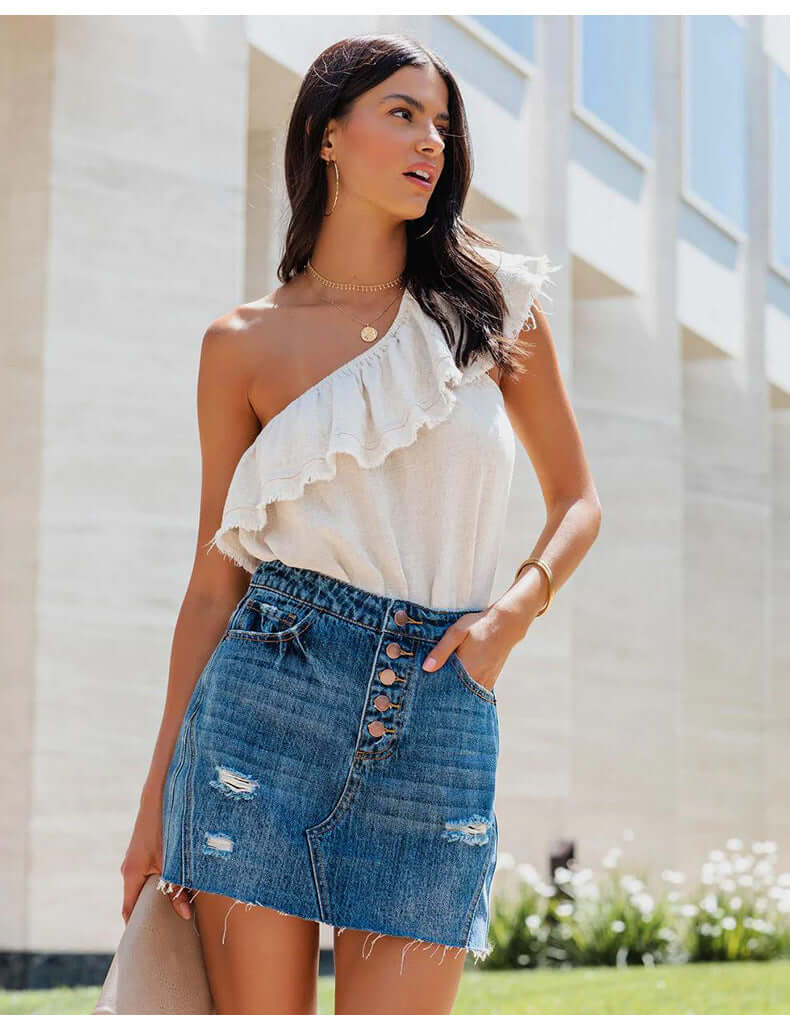 Jupe en jean courte femme bleue, taille mi-haute, déchirures et franges