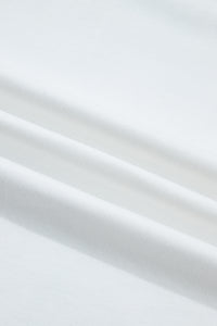 Tissu de haut femme blanc en coton, surface lisse et légère