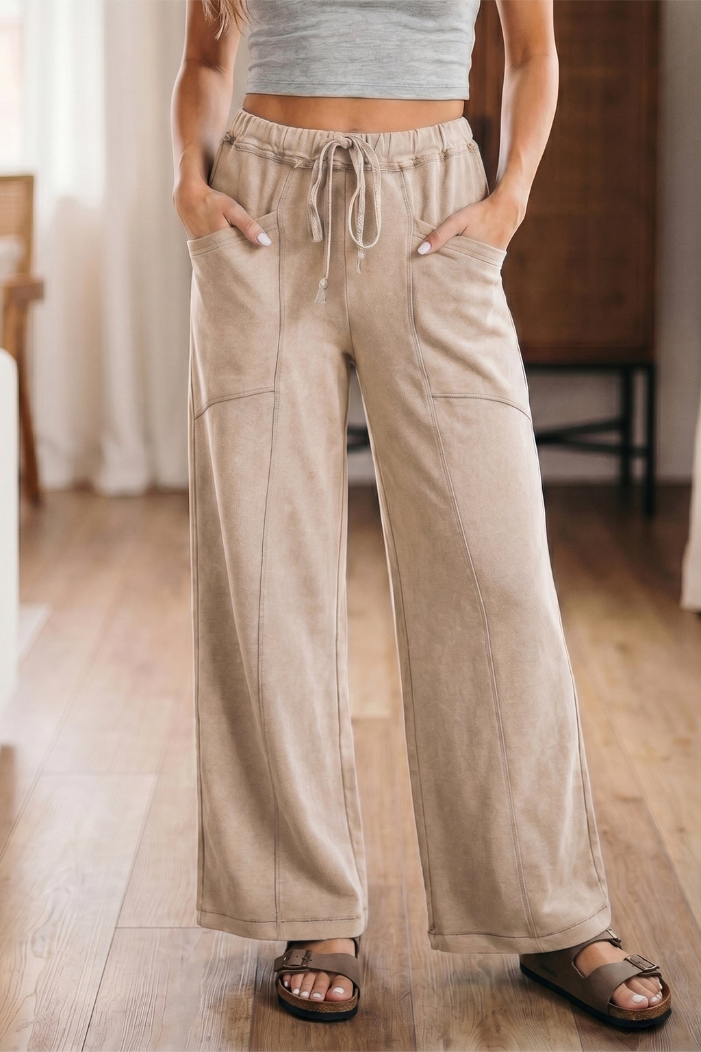 Pantalon taille haute ample à cordon, tissu beige, poches latérales et coutures