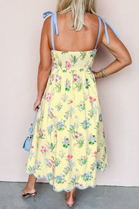 Robe midi jaune clair à fleurs, dos avec bretelles à nouer, taille froncée