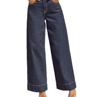 Jean bleu marine délavé, jambe ample, taille haute, braguette zippée et poches