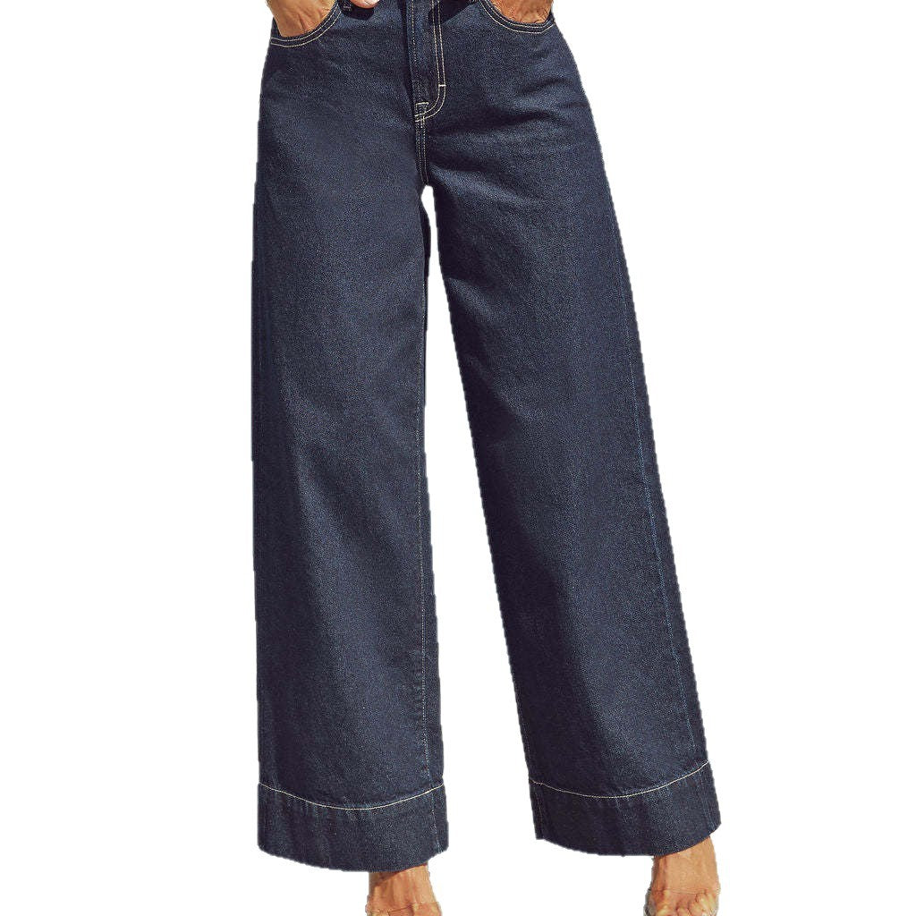 Jean bleu marine délavé, jambe ample, taille haute, braguette zippée et poches