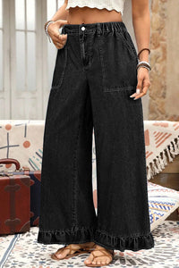 Pantalon jean noir ample, taille élastique, poches plaquées et bas volanté