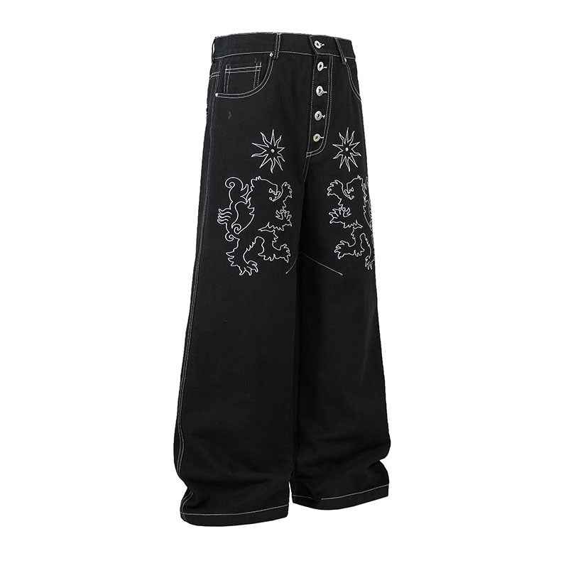 Pantalon jean femme noir large, broderies florales sur les jambes, fermeture boutonnée.
