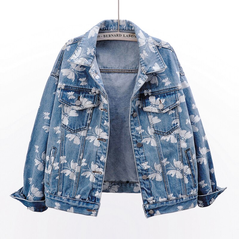 Veste en jean bleue pour femme, motif floral blanc sur le devant, poches et poignets boutonnés