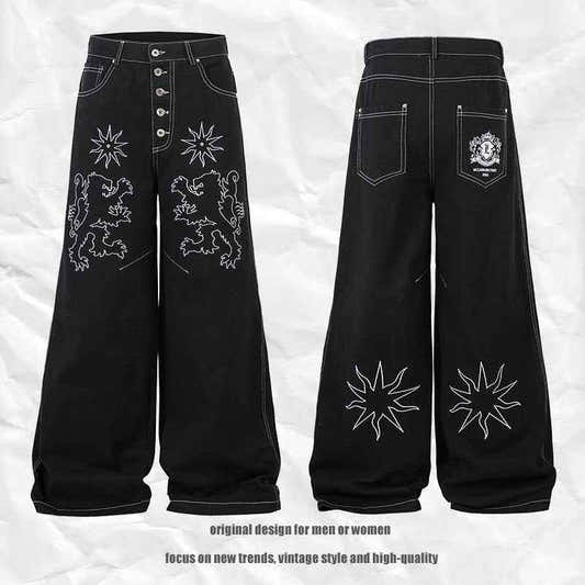 Pantalon jean femme noir large, broderies florales sur l’avant et l’arrière, jambe droite.