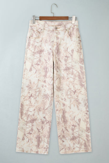 Jean large femme en toile à motif camouflage rose clair, taille haute, coupe ample.