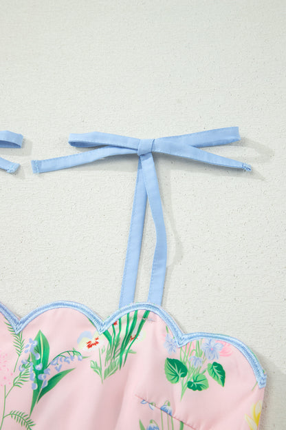 Haut de robe rose à bretelles nouées bleues, imprimé floral, fronces élastiques.