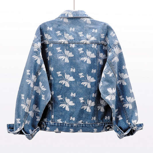 Veste en jean bleue pour femme, dos motif floral blanc, fermeture boutonnée et col