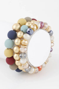 Bracelet perles multicolores bleu clair et moutarde, cristaux, billes dorées, plaque ovale
