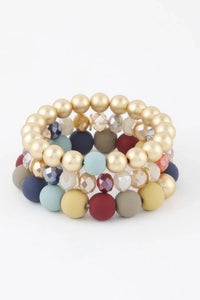 Bracelet perles dorées et cristaux, billes bleu clair, bleu marine et bordeaux