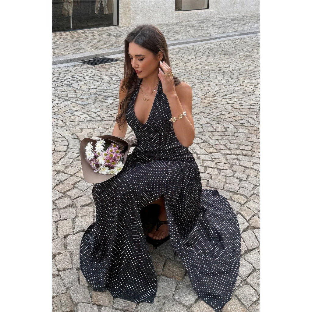 Robe longue noire à pois, col V halter, fente avant et tissu fluide