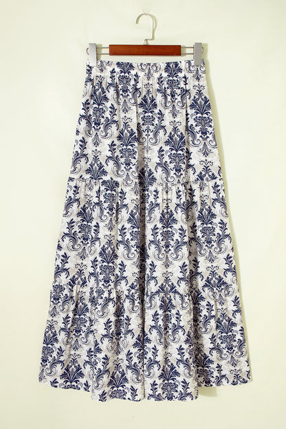 Jupe longue bleu et blanc à imprimé floral, taille élastiquée.