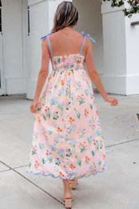 Robe midi florale à bretelles vue de dos, taille haute froncée, jupe évasée