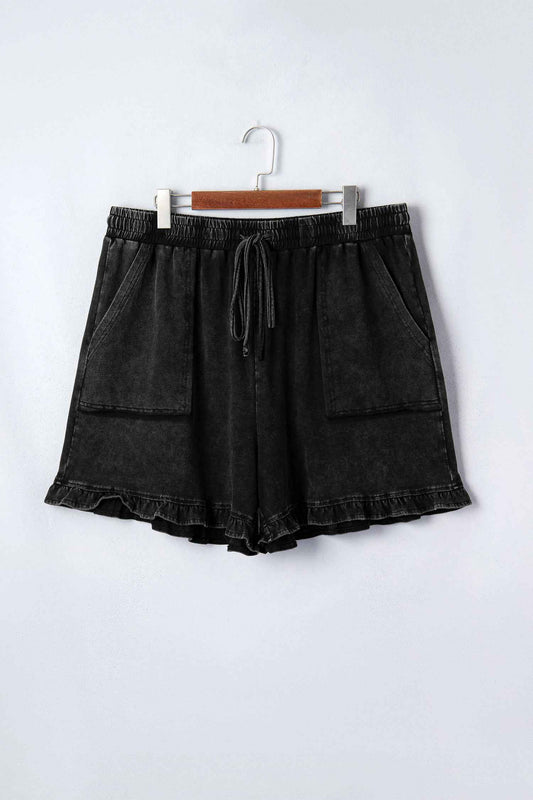 Shorts grande taille Élégants-noir vue de face sur un cintre