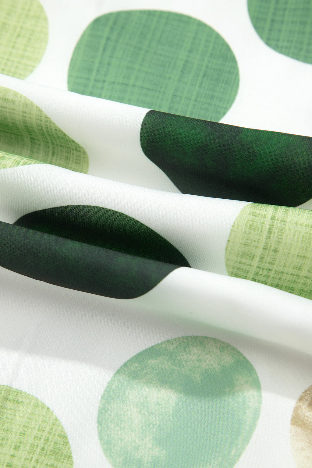 Tissu blanc à pois verts foncés et verts clairs, motifs ronds