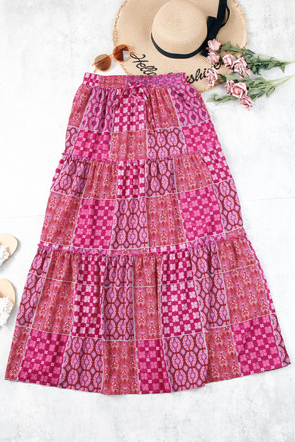 Jupe longue rose fuchsia à volants, motif cachemire, coupe évasée