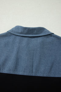 Haut polo bicolore en denim, vue dos : col et haut bleu sur base noire.