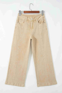 Jean femme évasé abricot sur cintre, taille boutonnée et poches
