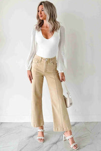 Jean femme évasé abricot, coupe large, surpiqûres sur la jambe