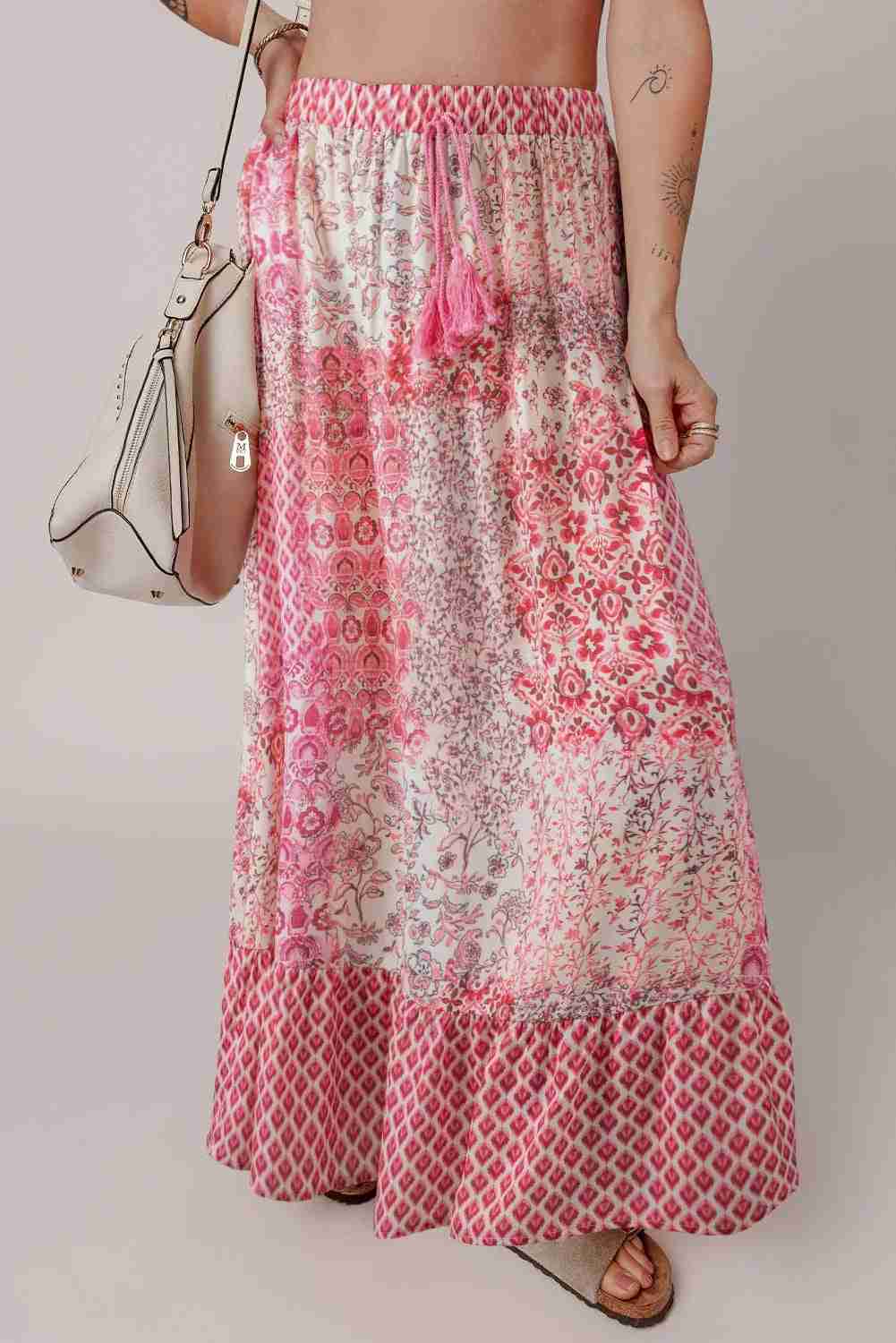 Jupe longue bohème rouge à motifs floraux, taille élastique et volants en bas