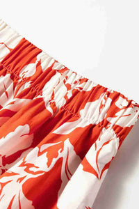 Haut de jupe rouge à fleurs blanches, taille froncée élastique