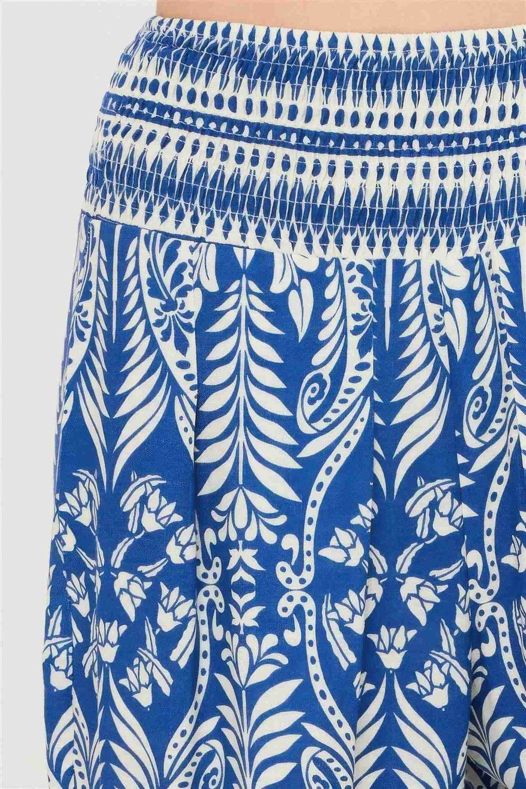 Pantalon bleu imprimé feuillages, taille smockée élastique