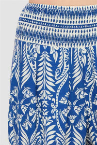 Pantalon bleu imprimé feuillages, taille smockée élastique