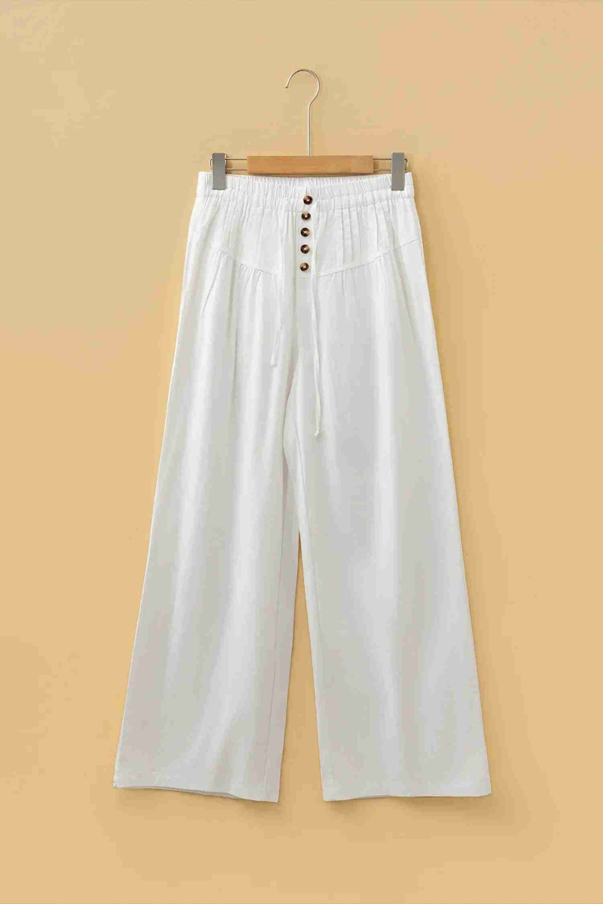 Pantalon large femme écru, ceinture élastique avec cordon et boutons sur le devant