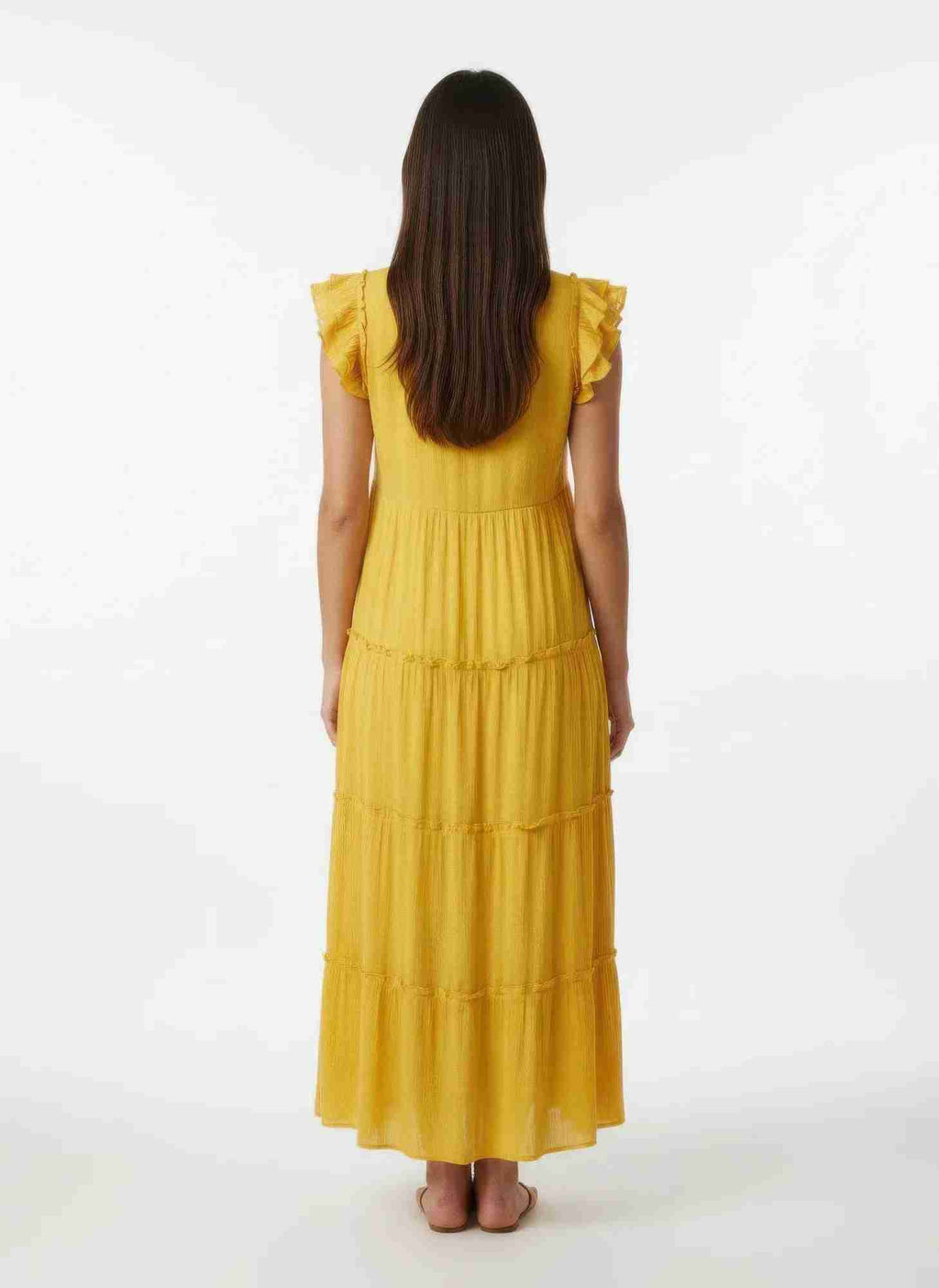 Robe jaune mi-longue, vue de dos, volants aux épaules et empiècements étagés