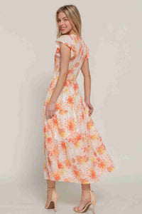 Robe florale smockée ivoire à manches à volants, vue de côté motifs orange