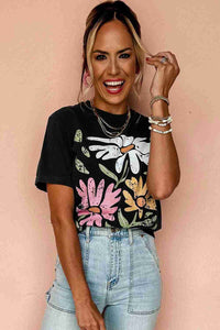 T-shirt femme noir à imprimé floral multicolore, col rond.