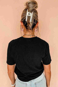 T-shirt femme noir uni, manches courtes, vue de dos.