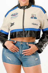 Veste courte zippée col montant bicolore ivoire et noire, liseré bleu, motifs poitrine